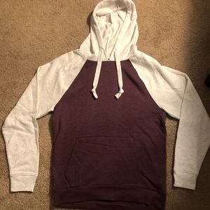 A maroon/white hooded sweatshirt